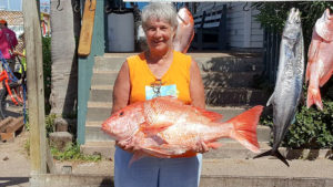 Woman holding large snapper