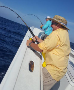 2 men fishing on the boat