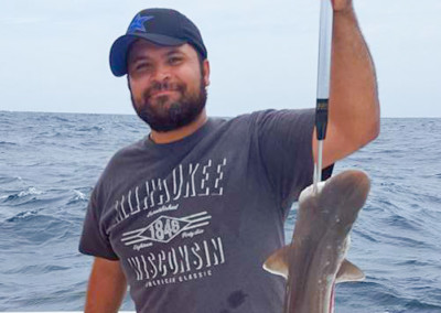 Man holding shark.