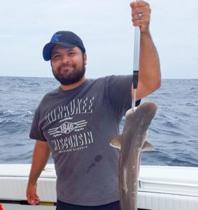 Man holding shark