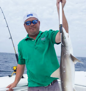 Man holding shark