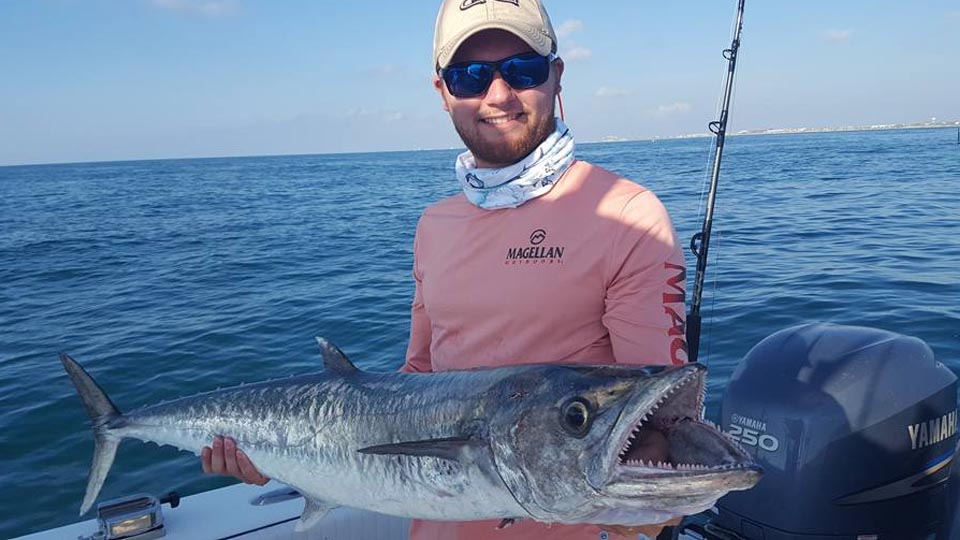 Man holding large fish.