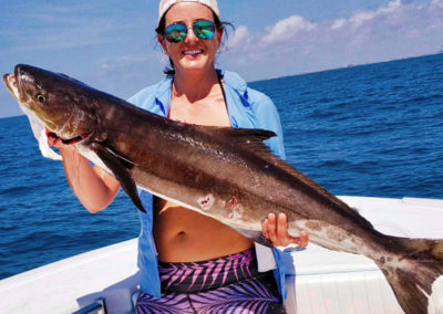 Girl holding a cobia