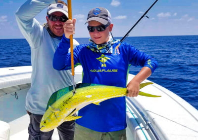 Boy with Mahi Mahi | Hot Spot Fishing Charters